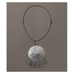 Anni Albers and Alexander Reed's Necklace (ca. 1940). Aluminum strainer, paper clips, and chain. The pendant is circular in shape, evenly punctured, from which some paper clips hang.