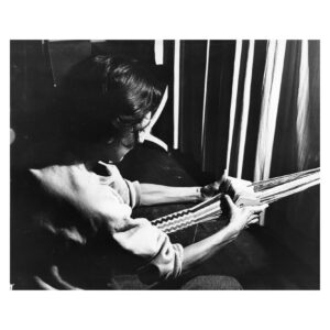 Black and white photo of Anni Albers card weaving at Black Mountain College, not dated.