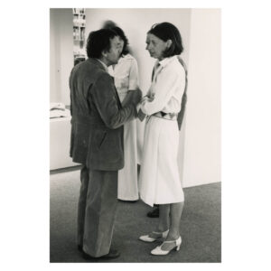 Black and white photo with Friedel Dzubas (left) and Helen and M. Hughton (right), talking in 1977 at Andre Emmerich HF opening.